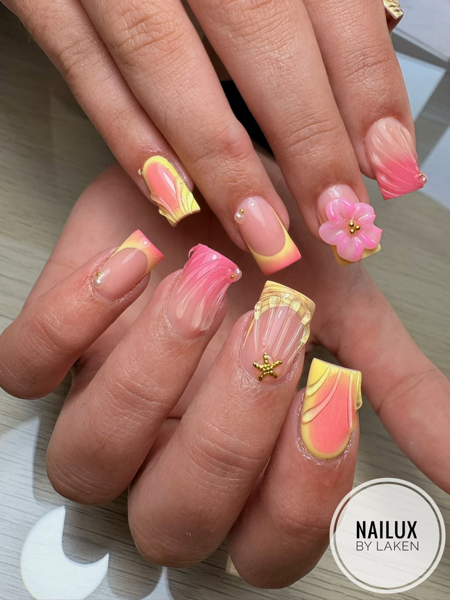 Pink and yellow summer gel nail art with 3D flower design at NAILUX Malta